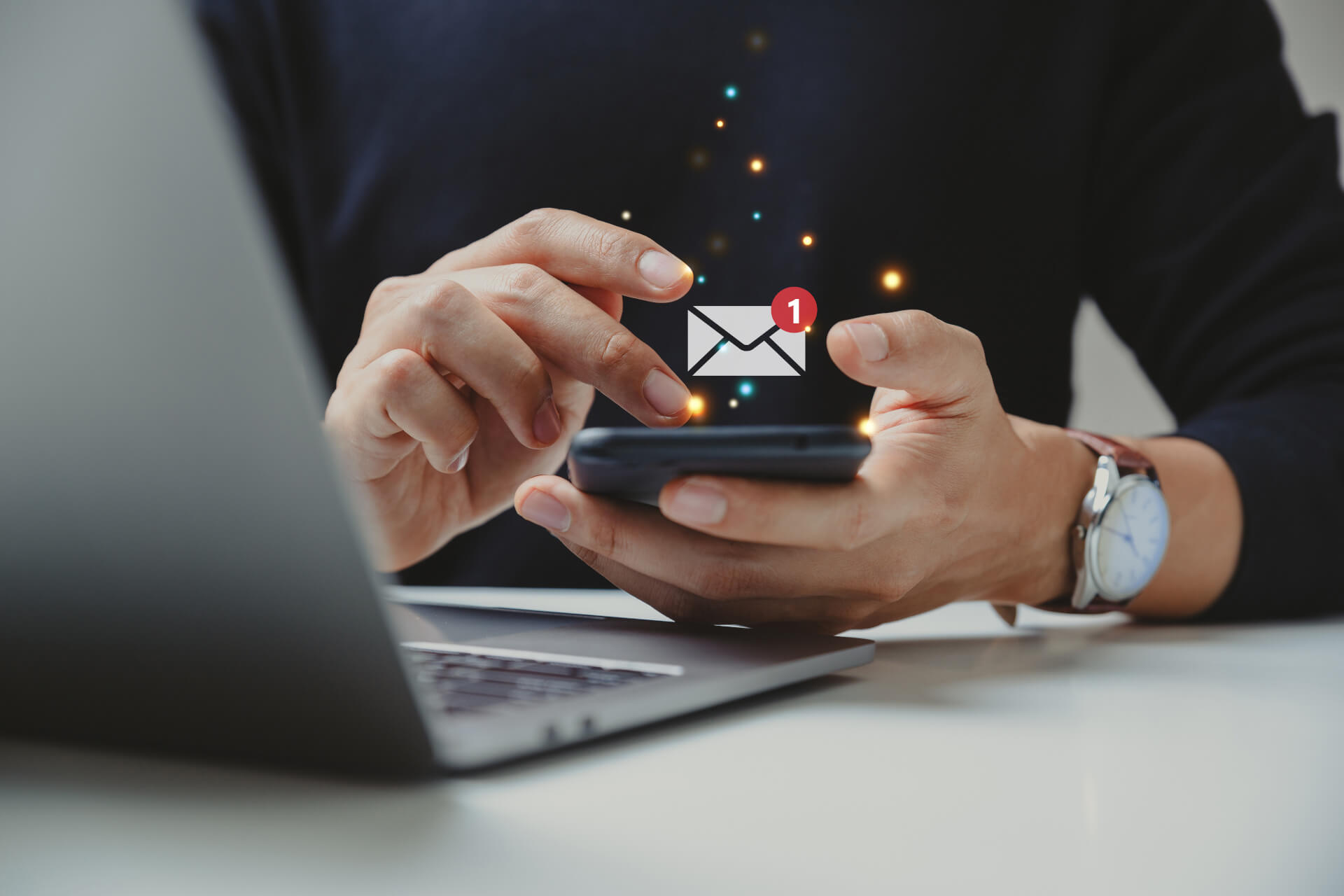person sitting and checking email on phone