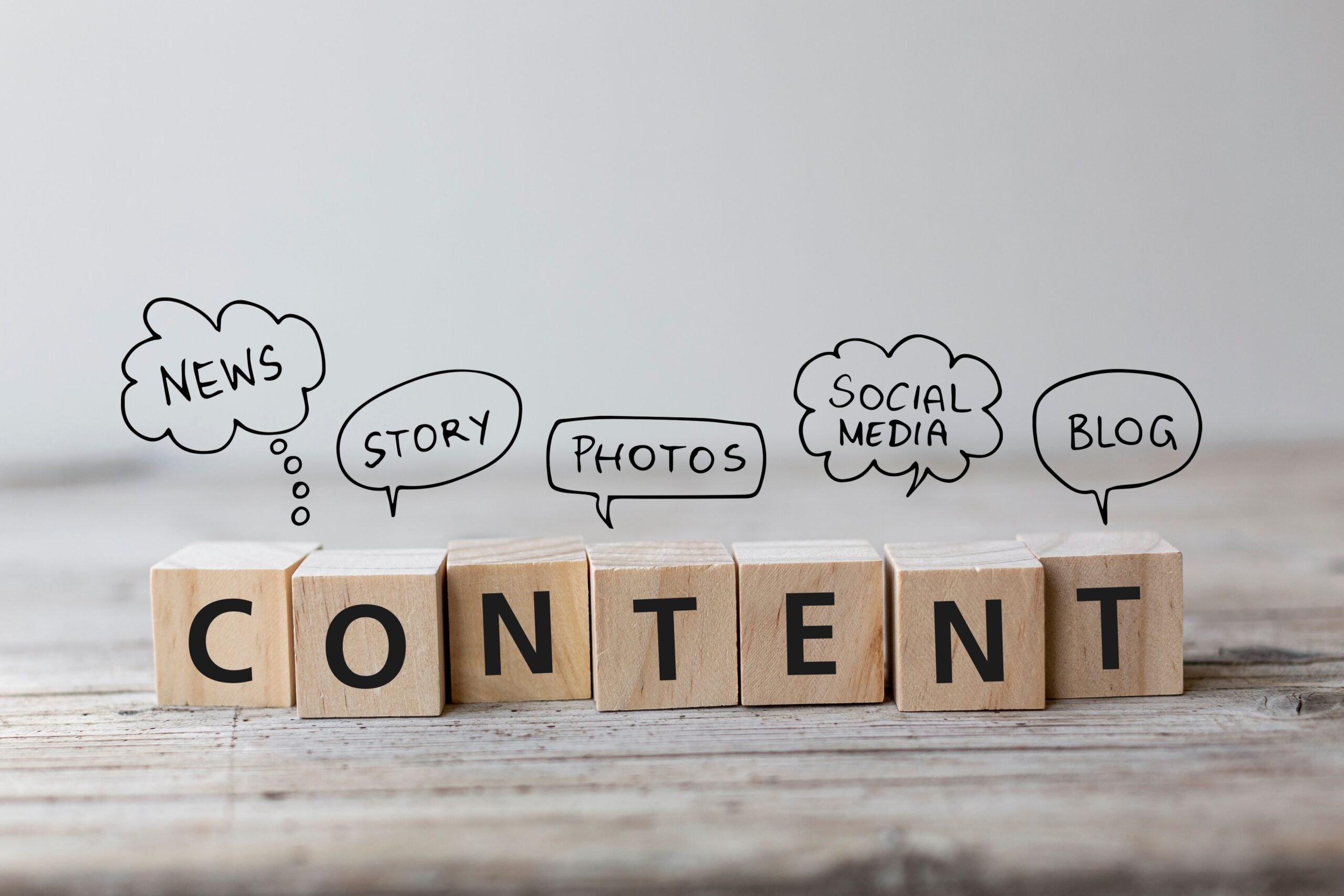 the word content spelled with scrabble pieces