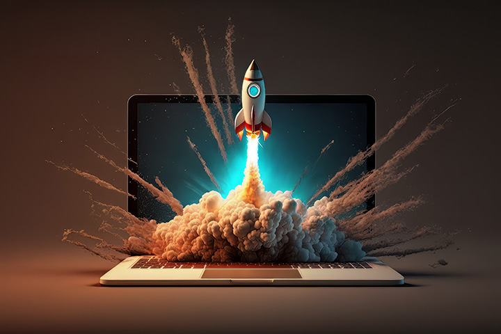 Illustration of a rocket ship launching out of a laptop